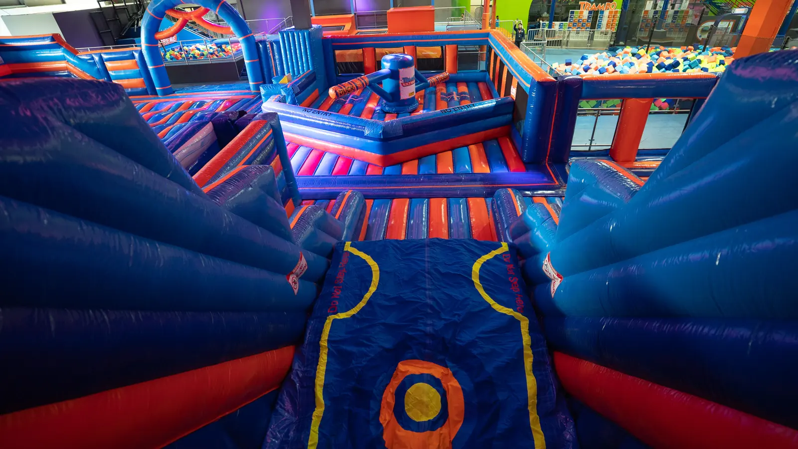 View from the top of the inflatable slide over the battle zone and foam pit at Trampo Murouj
