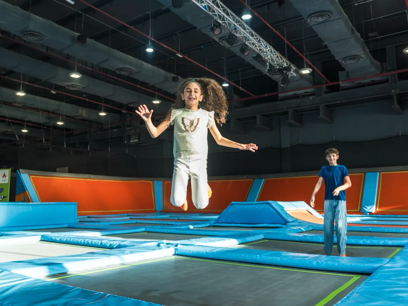 Girl jumping with peace sign at Trampo Kuwait