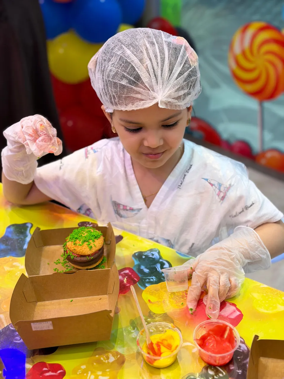 Kids making candy at Cricket's Candy Creations, Trampo Murouj