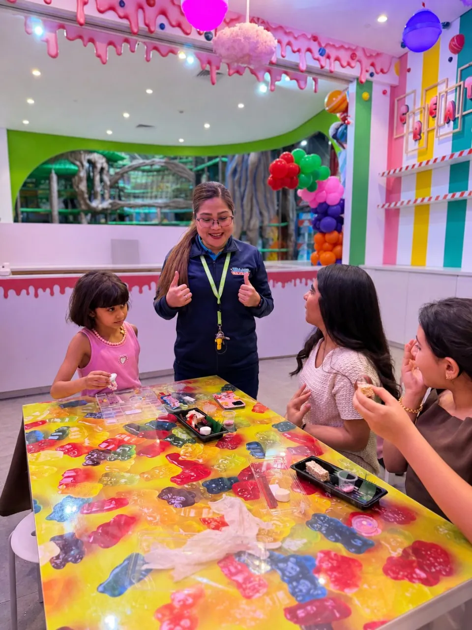 Kids making candy at Cricket's Candy Creations, Trampo Murouj