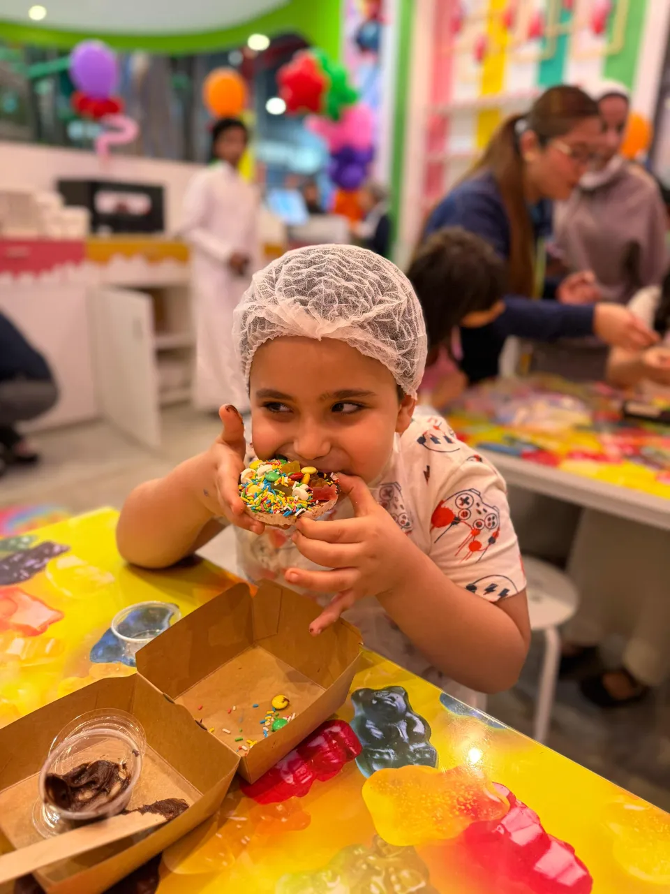 Kids making candy at Cricket's Candy Creations, Trampo Murouj